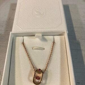 Swarovski rose gold with pink/red stone